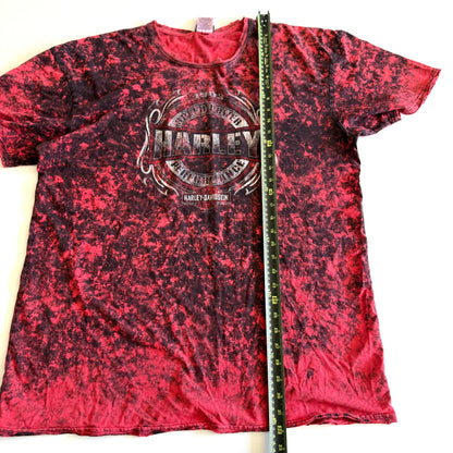 Pinky red t-shirt with black ie dye effect, and the harley davidson logo on the front - on a white background.  With a tape measure aid on it. 