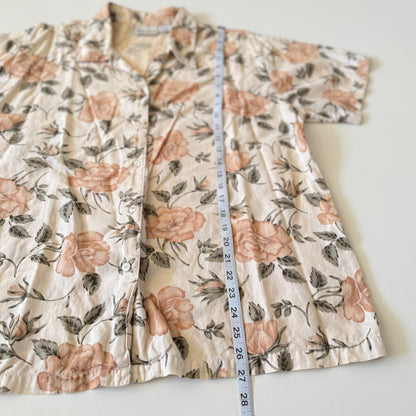 Floral-patterned garment with a measuring tape on a white background