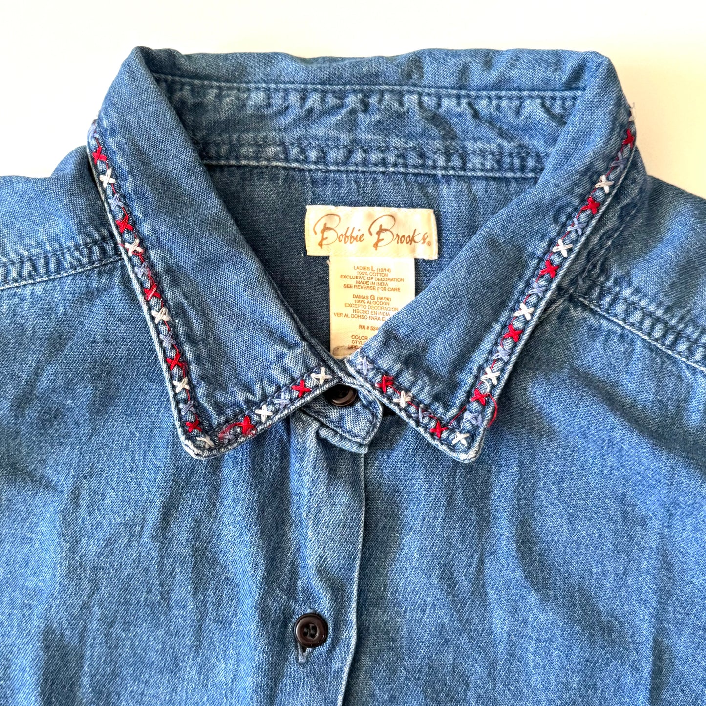 Blue denim shirt with embroidered collar and Eddie Bauer label