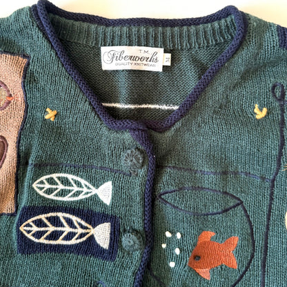 Children's sweater with fish design and Fiberworks label
