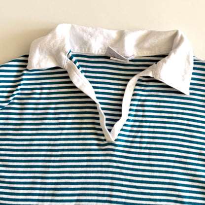 White and turquoise striped tank top with polo neckline, on a white backdrop. 