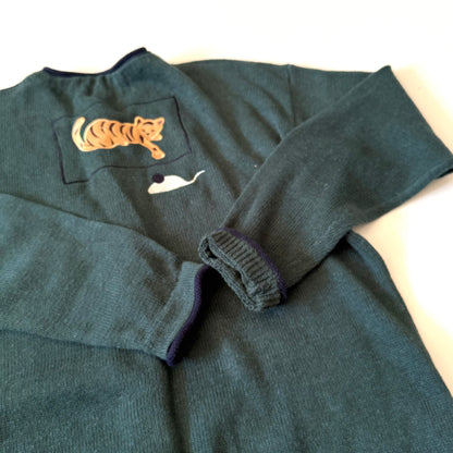 Dark gray sweater with a tiger patch on a white background