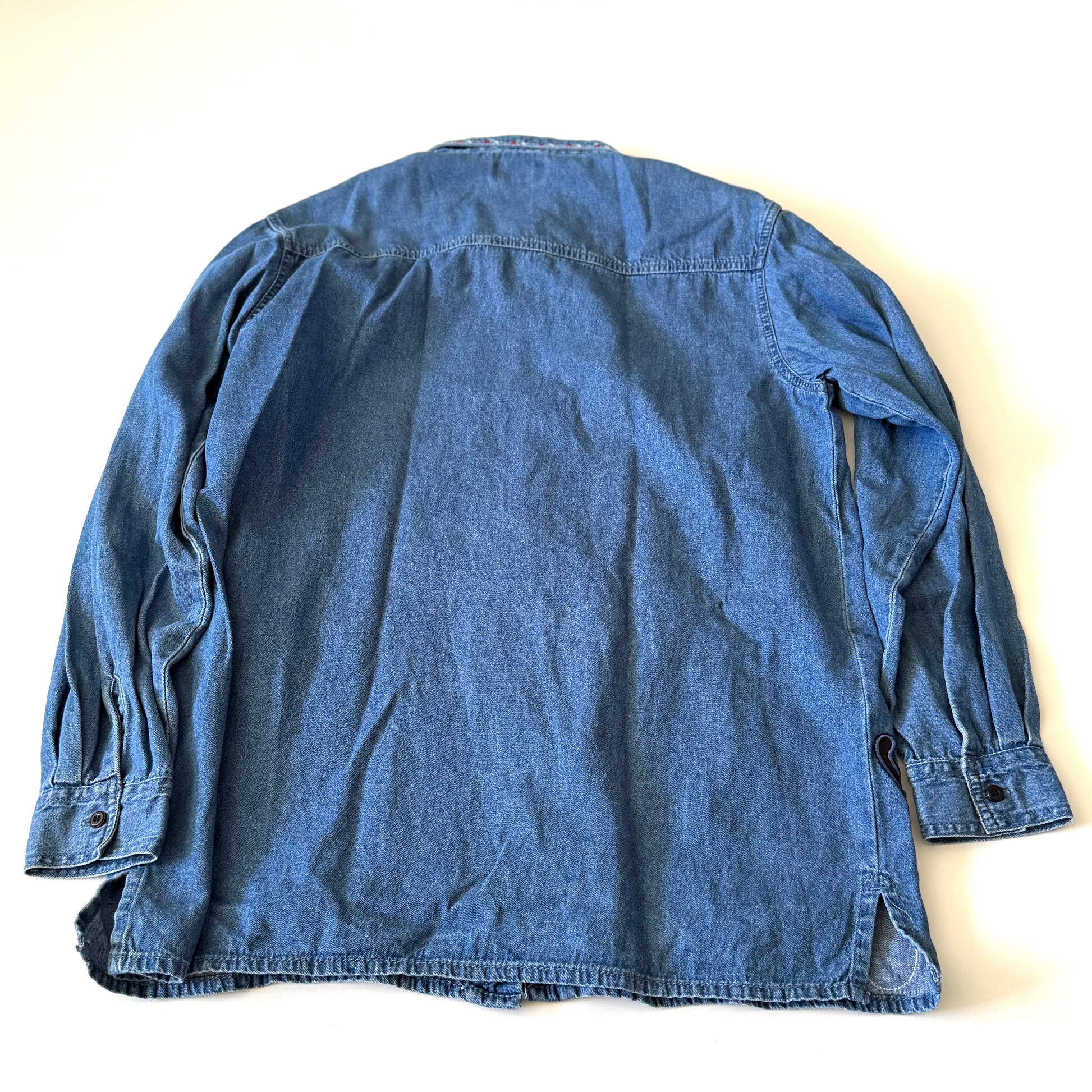 Blue denim jacket on a white background