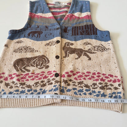 Knitted vest with animal pattern and measuring tape for size reference