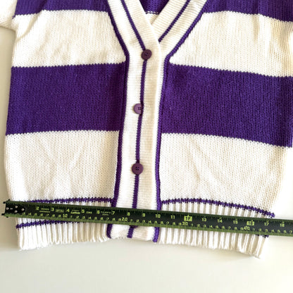 1990's preppy style - purple and white striped cardigan with a measuring tape on it on a white backdrop. 