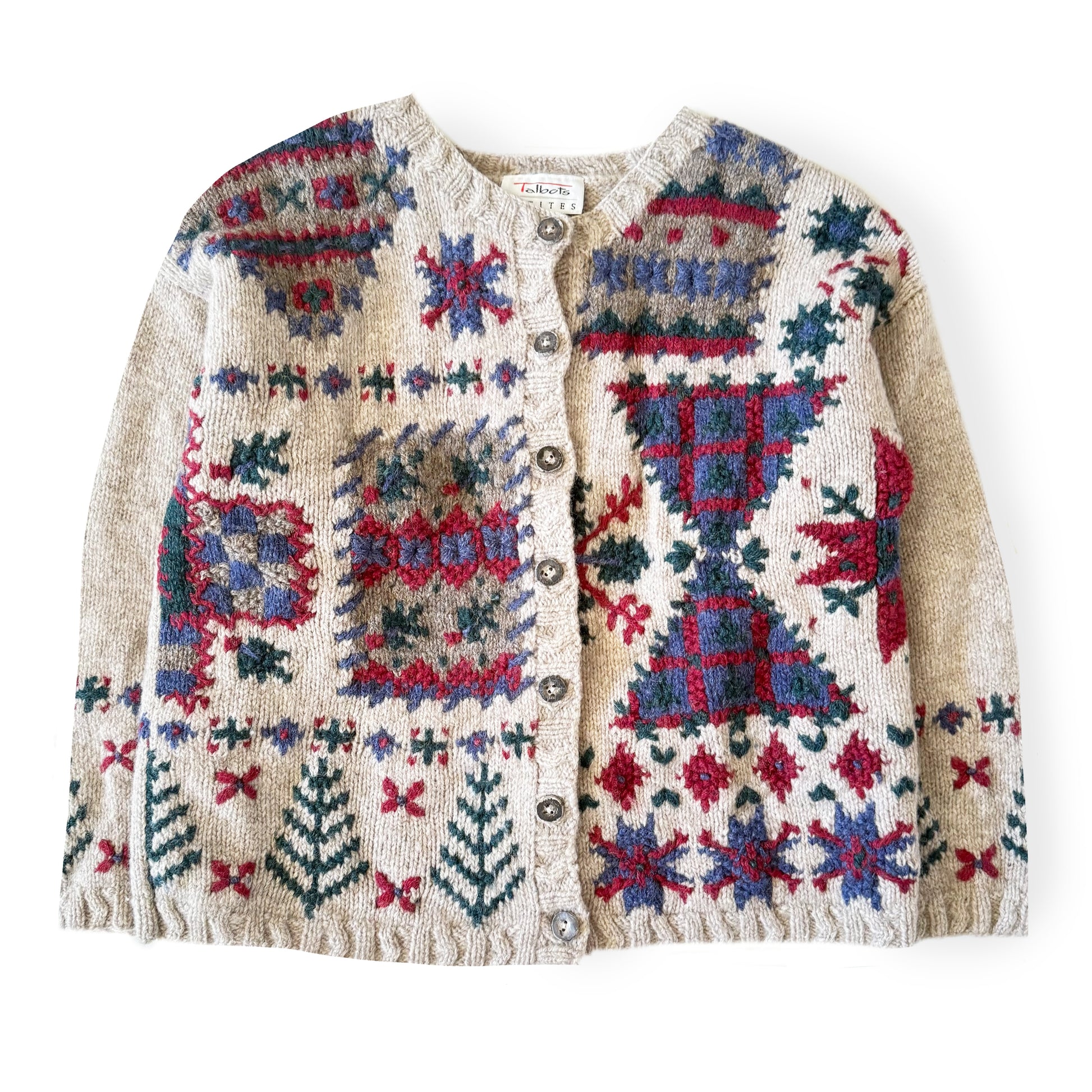 Knitted cardigan with colorful geometric pattern on a white background