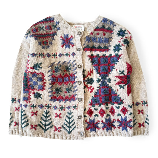 Knitted cardigan with colorful geometric pattern on a white background