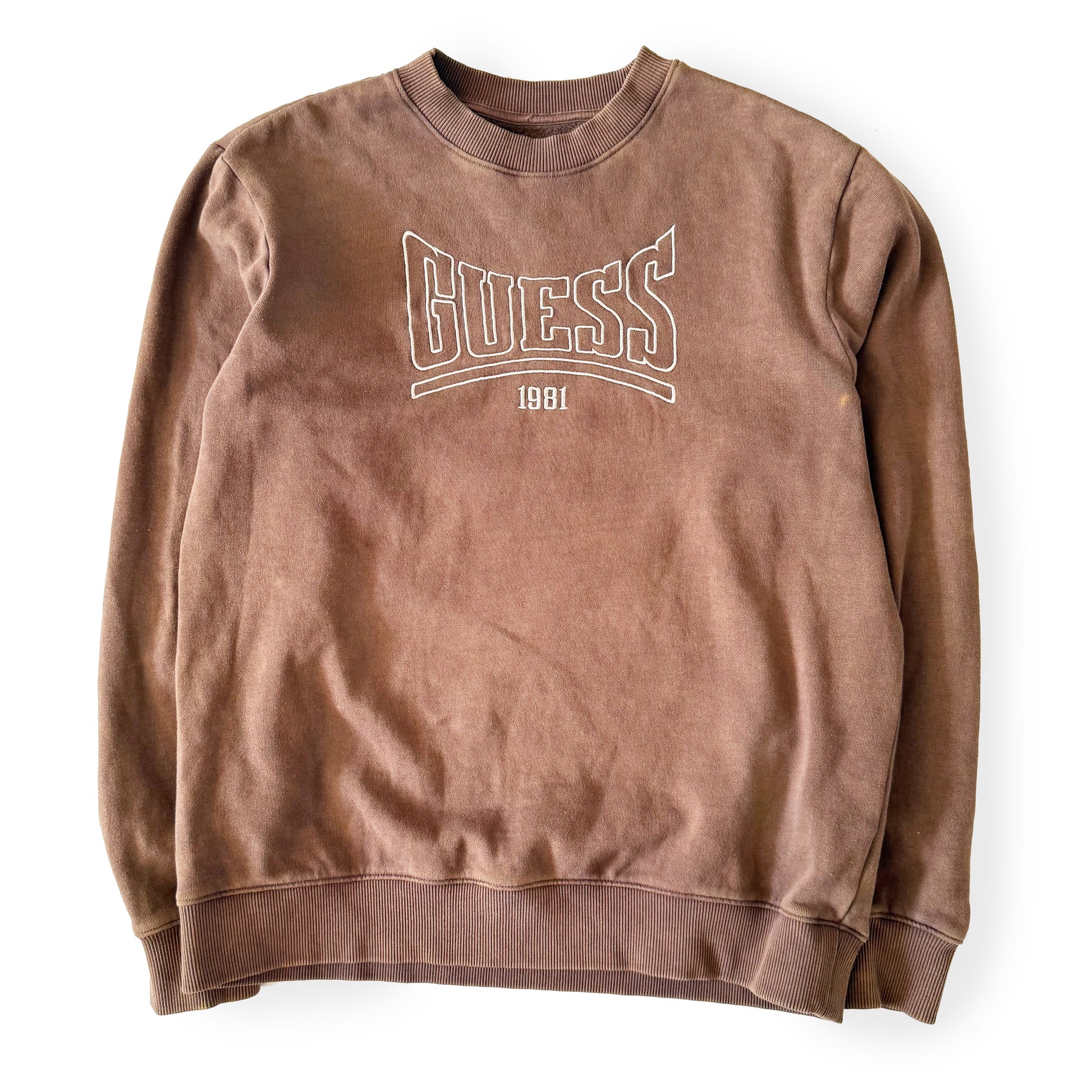 Brown sweatshirt with 'Guess' logo on a white background