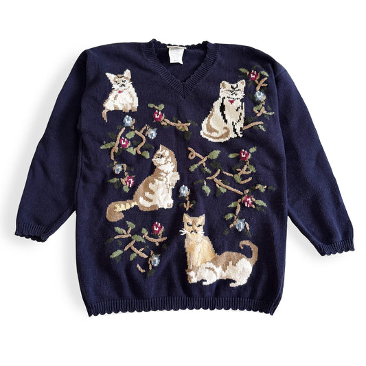 Navy blue sweater with cat illustrations on a white background