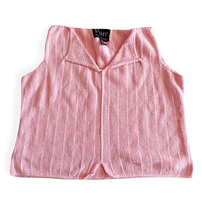 Light pink knit style tank top, with folded out collar opening on a white backdrop. 