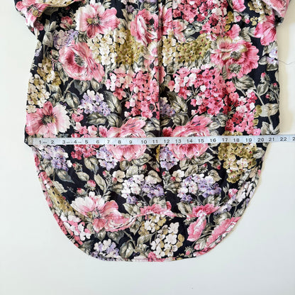 Floral-patterned fabric with a measuring tape indicating dimensions on a white background