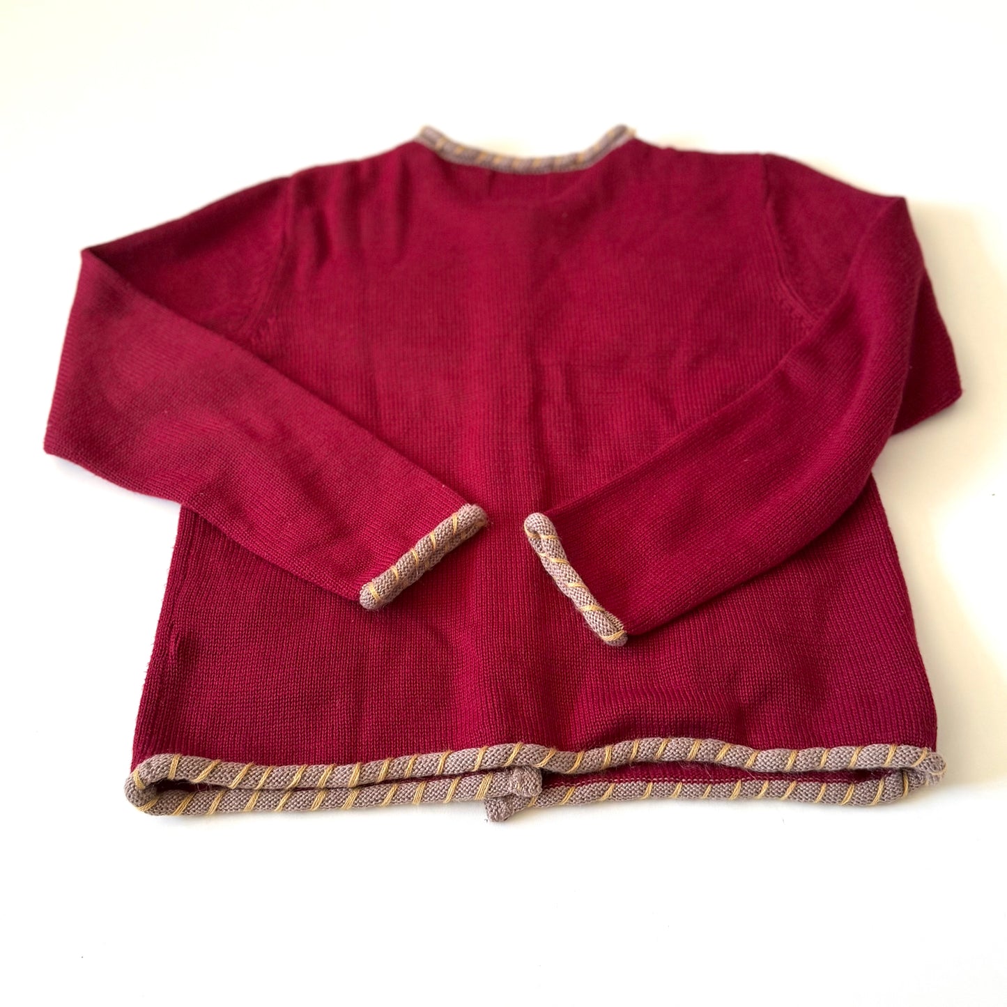 Back of red cardigan.
