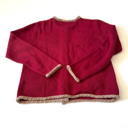 Back of red cardigan.
