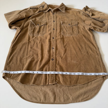 Brown button-up shirt with a measuring tape at the bottom on a white background