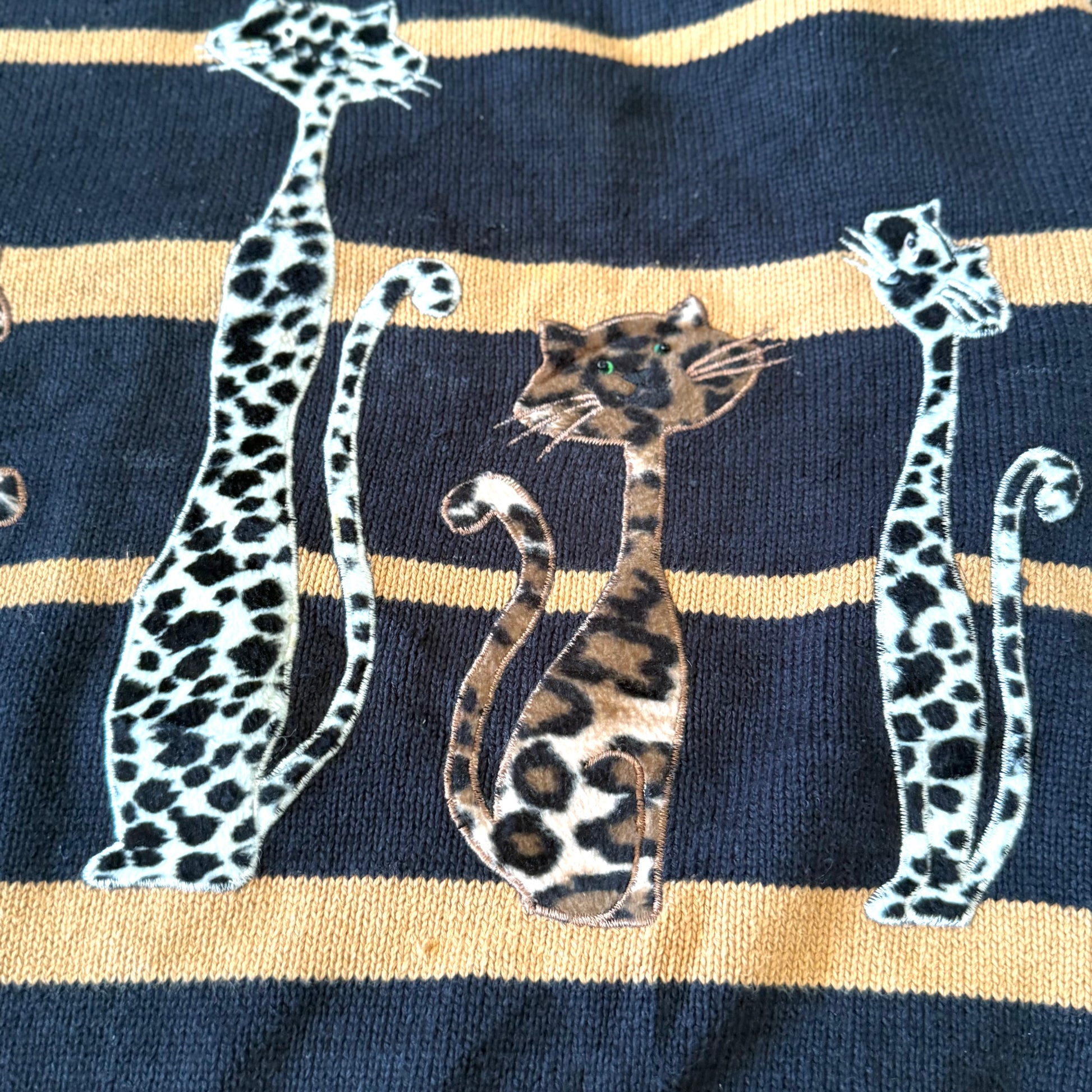 Navy blue sock with gold stripes and leopard print design