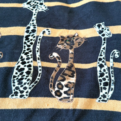 Navy blue sock with gold stripes and leopard print design