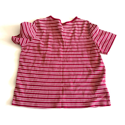 The backside of a white, pink, and red striped t-shirt with a v-neck collar on a white backdrop. 