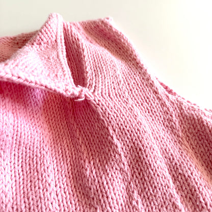 Showing that the opening collar detail is sewn into the shirt to stay open. 