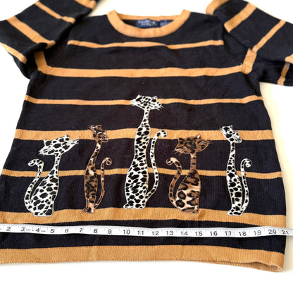 Striped sweater with animal designs on a white background