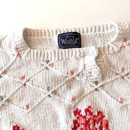 Knitted sweater with a pattern and Woolrich label on a white background