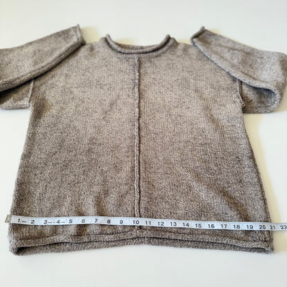 sweater with measuring tape on it