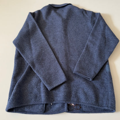 Blue sweater on a beige background