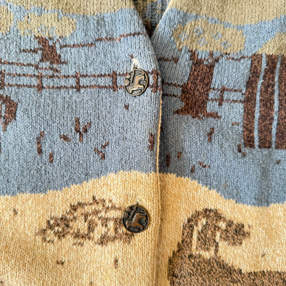 Close-up of a patterned fabric with blue, beige, and brown colors.