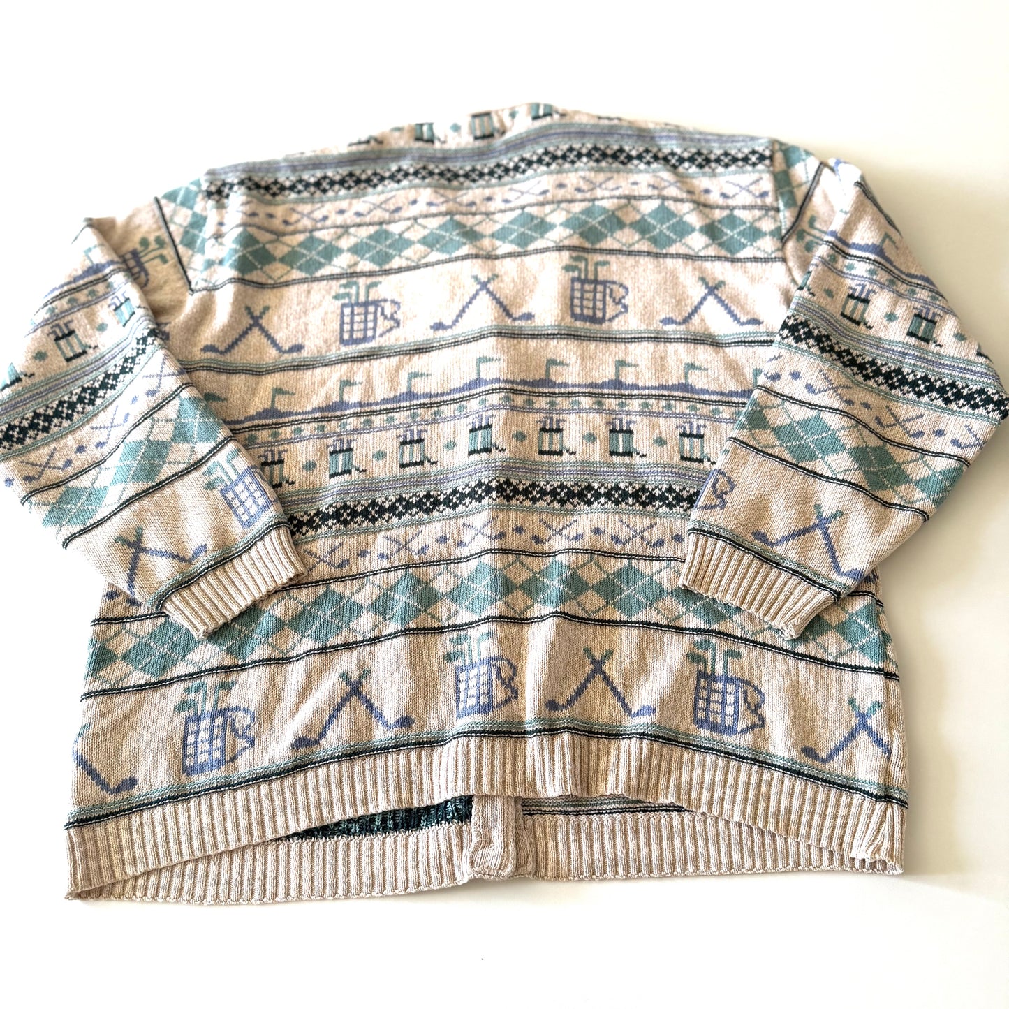 Back side of Golf themed cardigan with a white backdrop. 