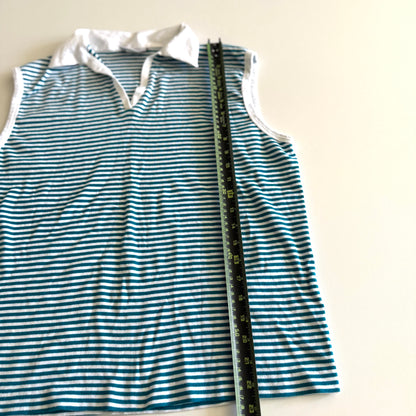 White and turquoise striped tank top with polo neckline, on a white backdrop and a measuring tape laid on top of it. 