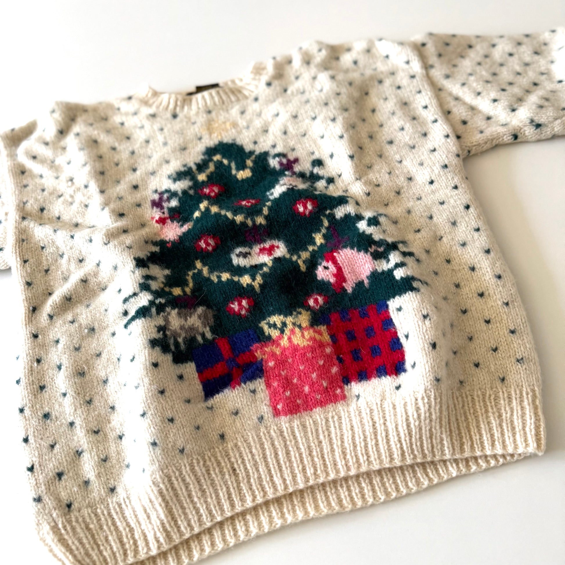 Knitted sweater with a festive design on a white background