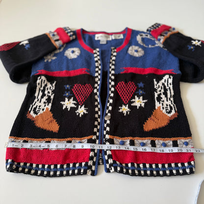 Colorful children's sweater with patterned design on a white background