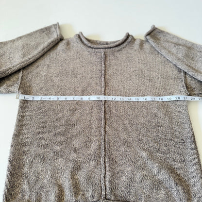 sweater with measuring tape on it