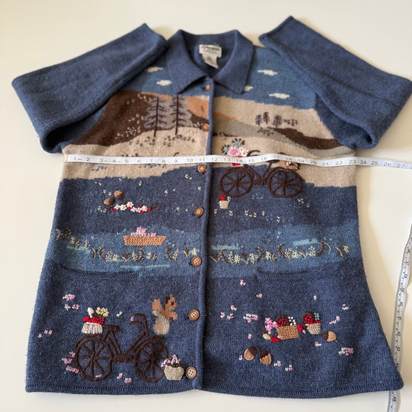 Embroidered shirt with a scenic design on a white background