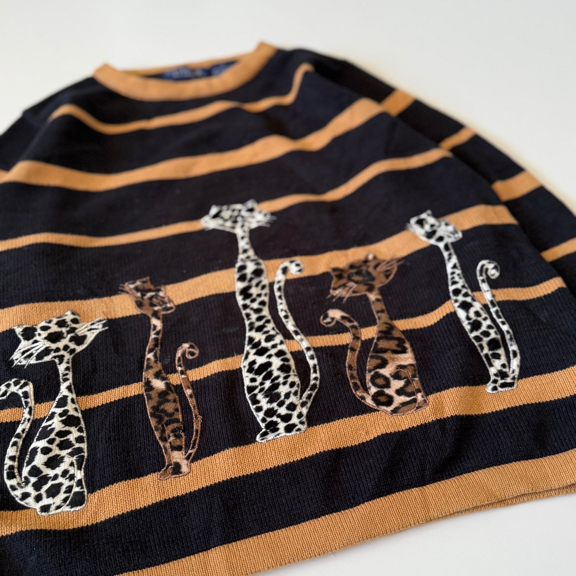 Striped shirt with animal prints on a white background