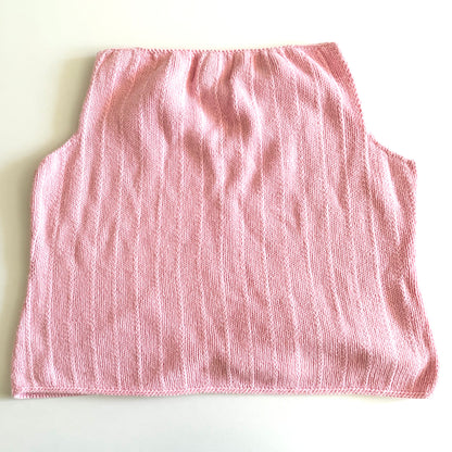 Back side of Light pink knit style tank top, with folded out collar opening on a white backdrop. 