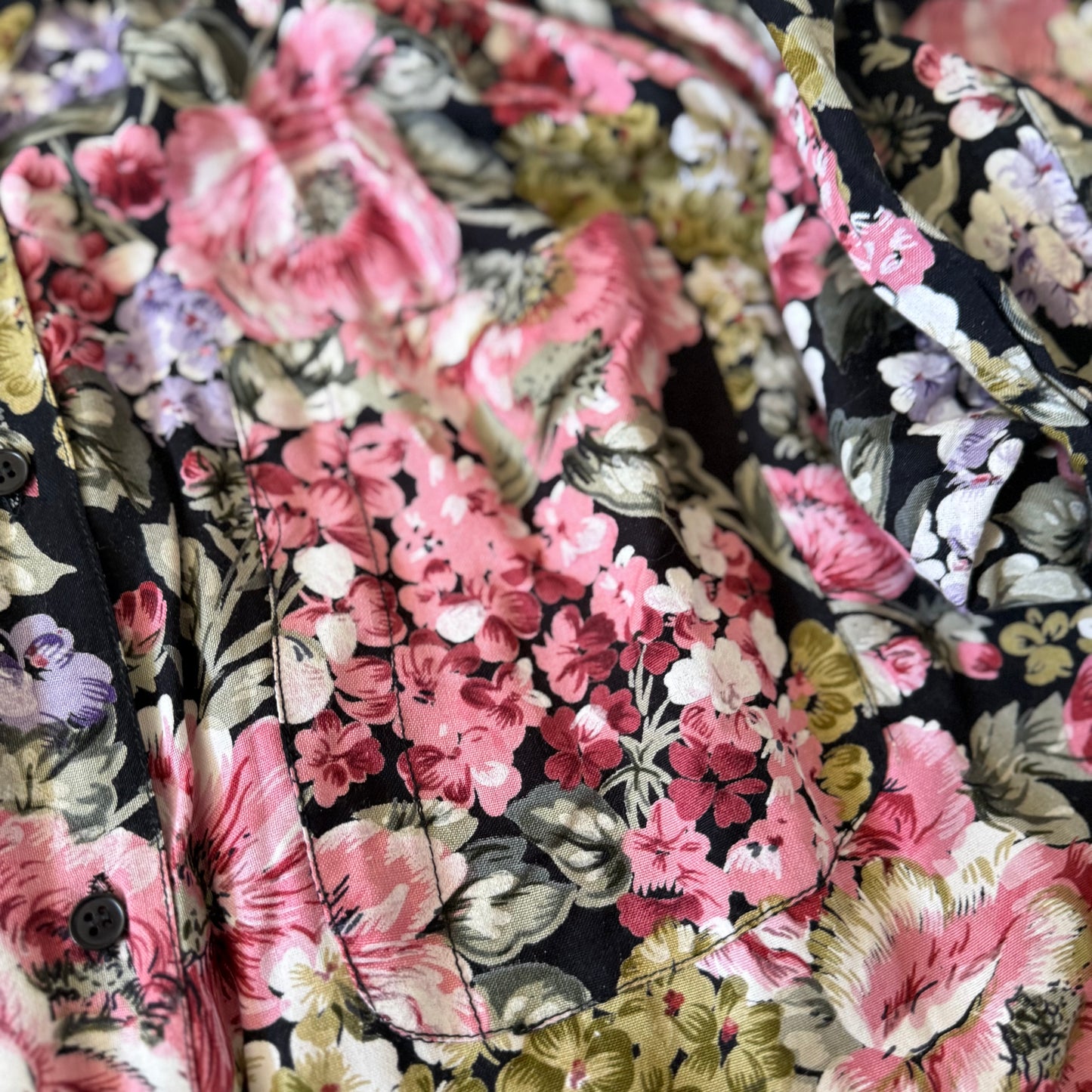 Close-up of floral fabric with pink and black pattern