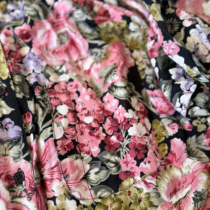 Close-up of floral fabric with pink and black pattern